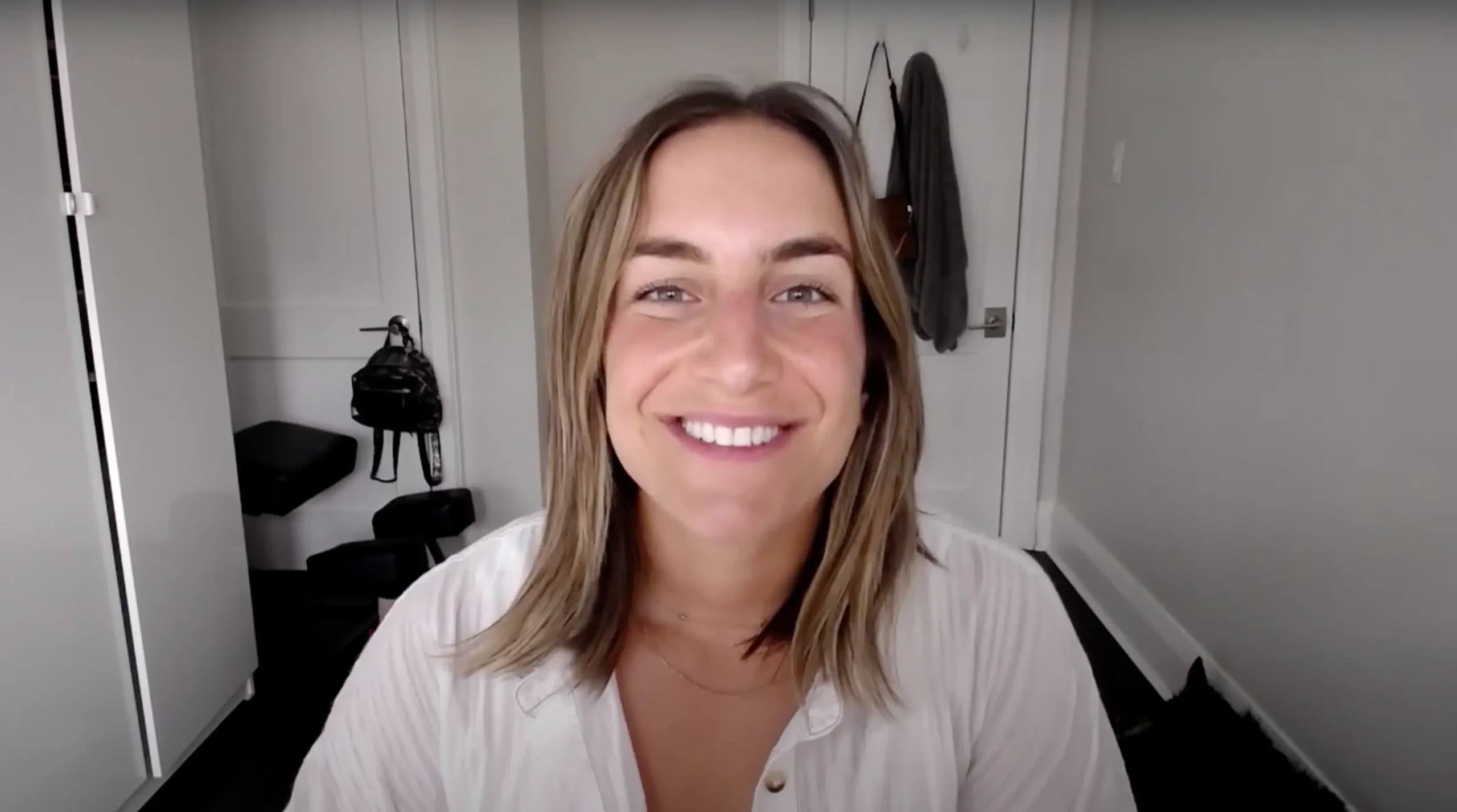 A happy Mellow Vibes Dog Training client giving a video testimonial